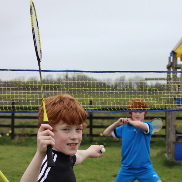 Children playing with the Hit Sport Aluminium & Fibreglass Badminton Racket