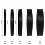 Set of black weight plates with measurements on a white background