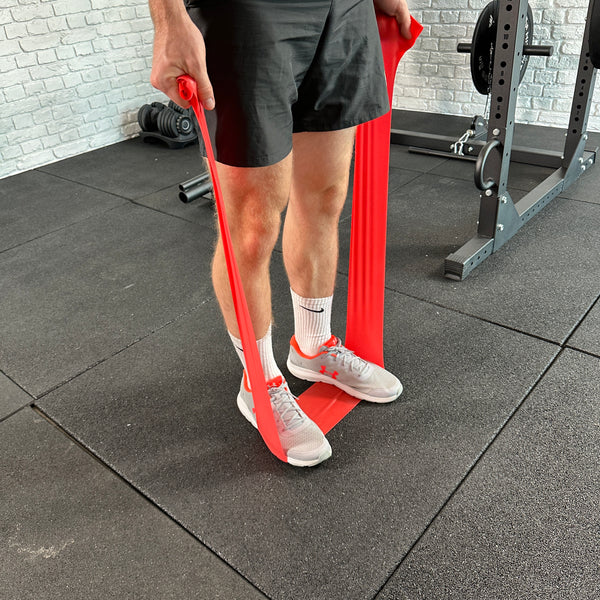 A Guy doing exercises with the Hit Fitness Power Flat Resistance Bands | 3 Pack