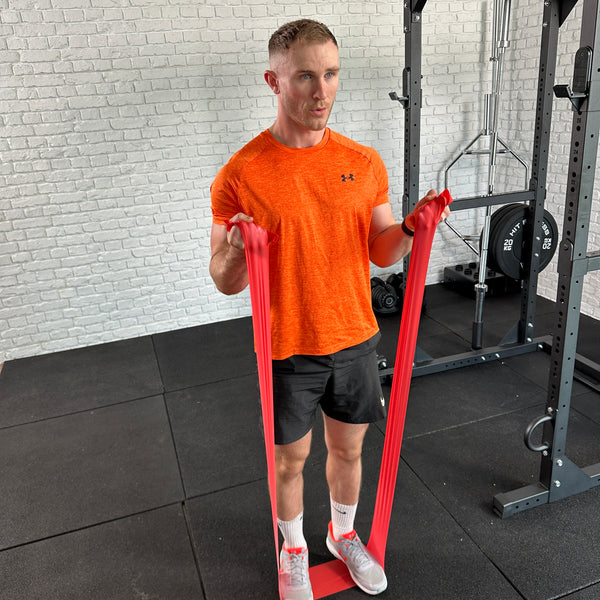 A Guy doing exercises with the Hit Fitness Power Flat Resistance Bands | 3 Pack