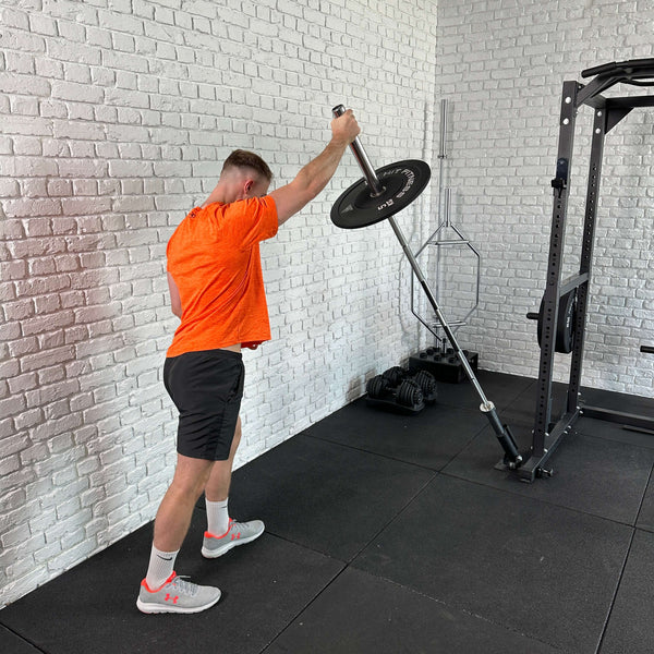 A Guy doing exercises using the Hit Fitness F200 Pro / Half Rack Landmine Attachment