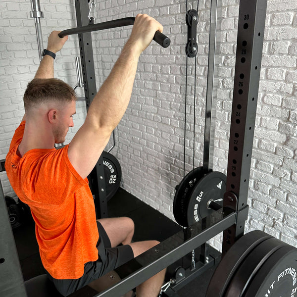 A Guy doing exercises using the Hit Fitness F200 Pro Power Rack Cable Pulley System