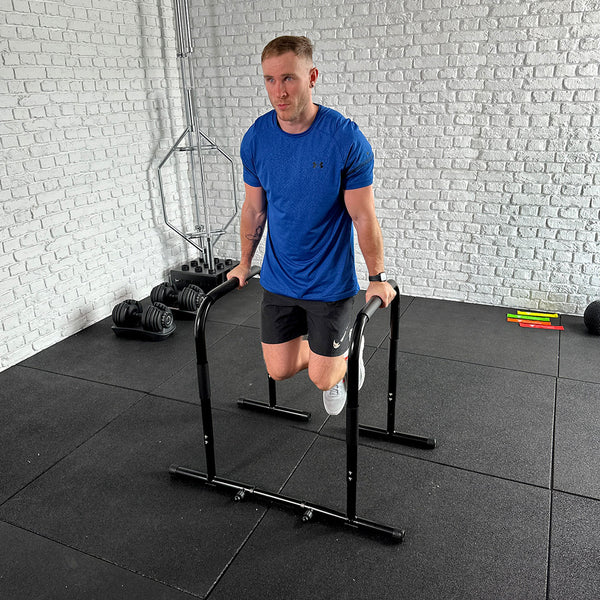 A Guy doing exercises using the Hit Fitness Parallel Dip & High Parallette Bars