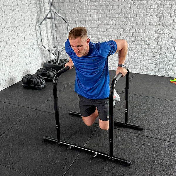 A Guy doing exercises using the Hit Fitness Parallel Dip & High Parallette Bars