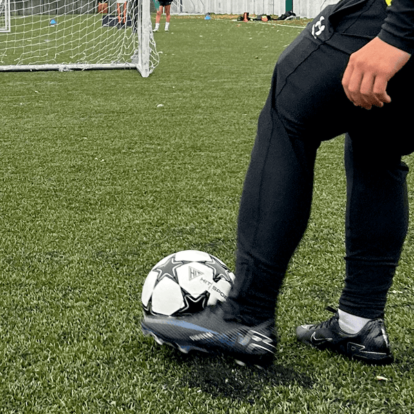 A Guy kicking the Hit Sport Match Quality Training Football | 370g (Under 14)