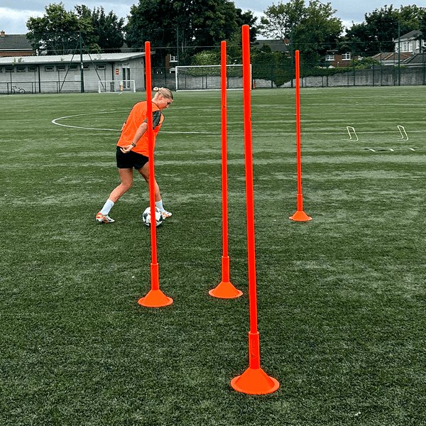 A Woman is training with the Hit Sport Pole Base
