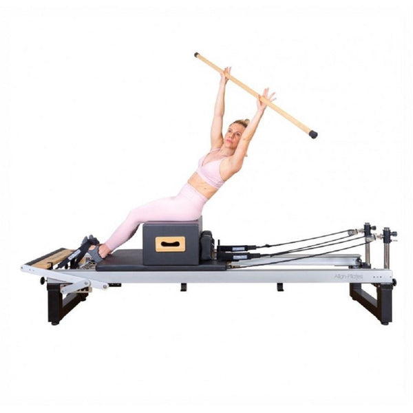 Pilates pole exercises on a Align Pilates A8 Pro Reformer