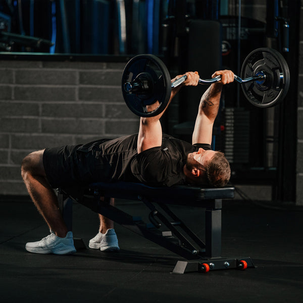 Hit Fitness 47 EZ Curl Bar - Man doing Overhead Press