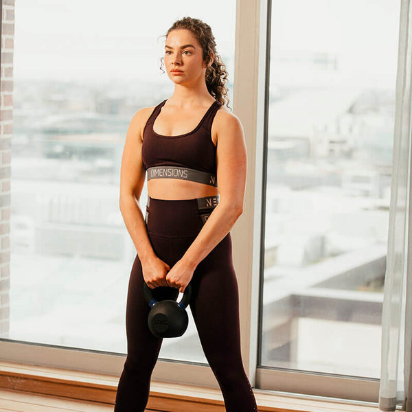 Hit Fitness Cast Iron Kettlebell | 20kg - Woman holding Kettlebell