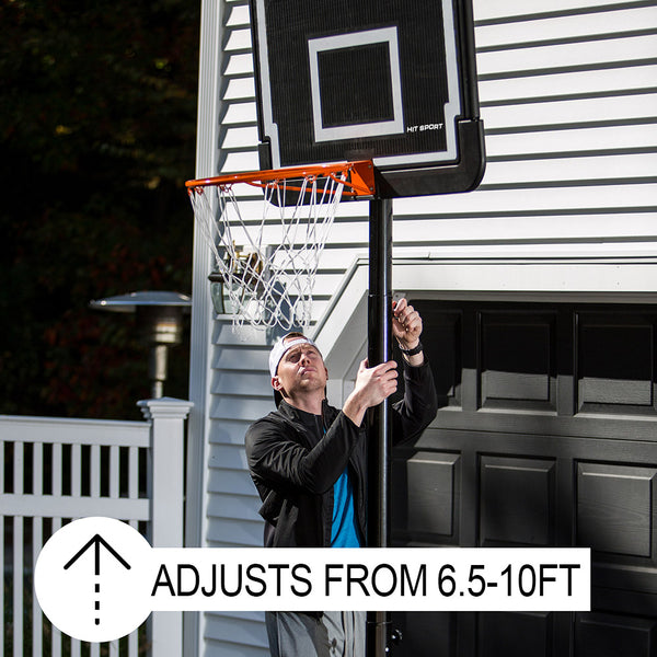 Basketball player adjusting the height of the Hit Sport Portable Adjustable Basketball Unit